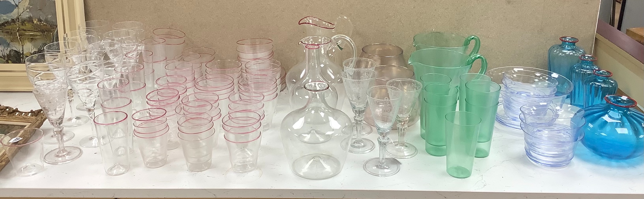 Venini Murano glass vases, jugs and carafes with red trailed rims, tallest 24 cm, la Murrina sets of glass bowls , a lemonade set, a set of Murano table glass with trailed pink rims etc.